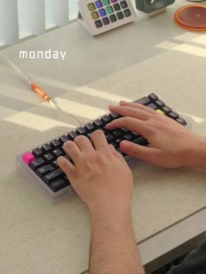 A post by @alexotos on TikTok caption: Here are some custom keyboards i use during the week. I like these things, they make me happy.  #mechanicalkeyboard #keebs #customkeyboard #desksetup #asmr 