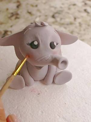 A post by @caketoppedwithlove on TikTok caption: Fondant Elephant Cake Topper #fondant #fondantcake #fondantart #cake #cakedecorating #cakedesign #cakevideo #caketok #fondanttoppers #caketoppers #caketopper #fondantdecoration #fondantart #fondantelephant #elephantcake #elephantcaketopper #caketutorial #caketutorials #safaricake #animalscake #animalscaketopper 