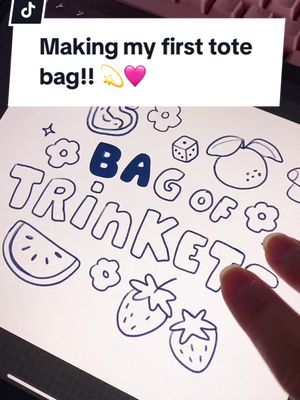 A post by @ivytart on TikTok caption: My first tote bag!!! I love it 💫 thanks again @HTVRONT for letting me try this out 🩷 #htvront #htvrontautopress #htvrontvinyl #htvrontcraft #htvrontheatpress #diytotebag #totebagart #makingatotebag #customtotebag #totebagdiy #strawberrytotebag #cutetotebag 