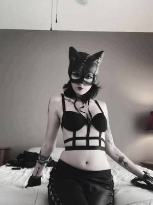 A post by @rockangel1218 on TikTok caption: Meow😉 #fyp #foryoupage #catwoman #meow #kitty #claws #halloween #spooky #lesbiansoftiktok #🏳️‍🌈 #thirsty #thirsttrap #🔥 #😈 #😉