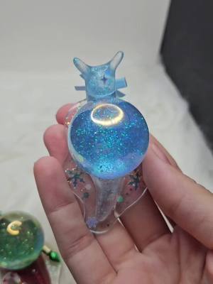 A post by @crimsonkateg on TikTok caption: Snowglobe snail desk buddies 🐌💖