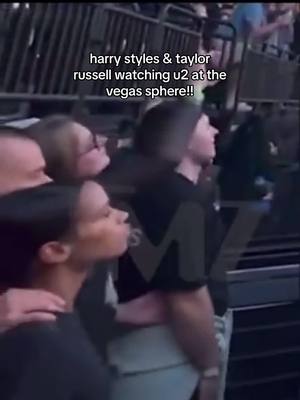 A post by @harryscanyon on TikTok caption: new video of harry styles & taylor russell watching u2 at the vegas sphere!!