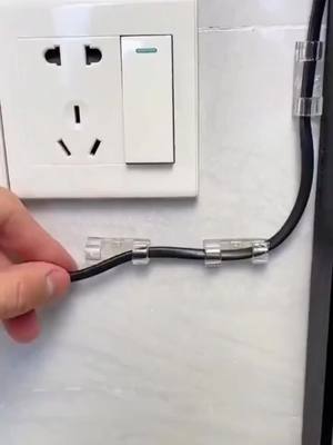 A post by @newlifehacks5_us on TikTok caption: Do you fix wires in your house or use nails? Try this no-punch wire holder for a beautiful and neat fix. #TikTokShopBlackFriday#foryou#liffehack#goodthing#fy#lifehacks#foryoupage#goodthings#fypage#amazonfinds#TikTokShop