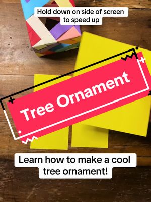 A post by @origamilesson on TikTok caption: Learn how to make a christmas tree ornament! #fyp #origamilesson #christmascountdown 