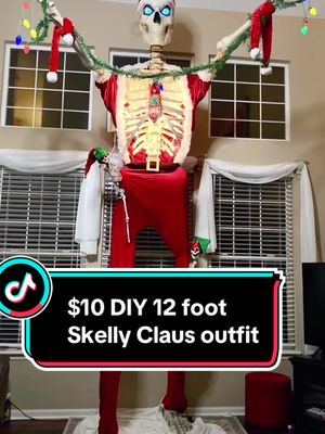 A post by @thathalloweenfamily on TikTok caption: For everyone who wants to DIY a 12 ft Skelly Claus for under $10! 3 years later still rocking the same outfit. This is how I make all my Skelly clothes, thrift sheets for the W! #skeletonchristmas #12footskeleton #skellyclaus #homedepot12footskeleton #diychristmas 