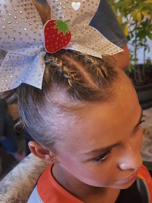 A post by @styledbyshaeb on TikTok caption: Competition cheer pony 🤍 #hairstyle #curls #eventhair #hairturtorial #slickback #daehairstylingcream #ponytailtutorial #compcheer #cheerhair #dutchbraids