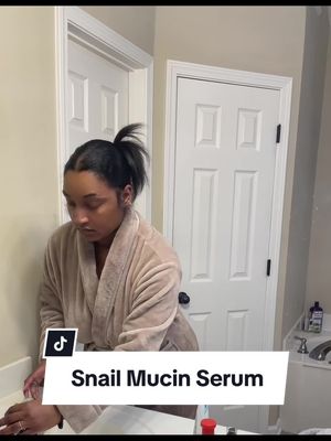 A post by @camillevaughn93 on TikTok caption: My nightime routine using the snail mucin serum. 3 weeks in and my skin is GLOWING. RUN and buy it!!#nightroutine #grwm #snailmucin #skincare #MomsofTikTok 