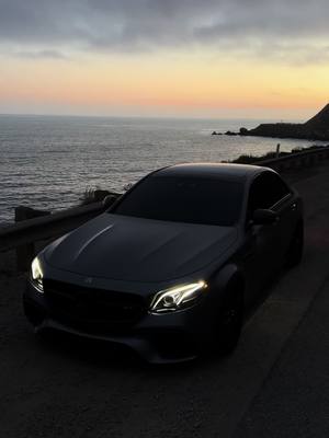 A post by @comp.m2 on TikTok caption: Should we go satin black🤔 #cars #e63s #w213 #amg #mercedesamg #viral #foryoupage #malibu #ocean #scenic 