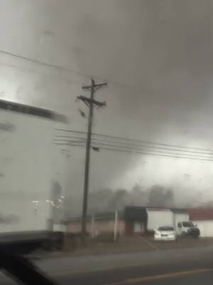 A post by @stormchasingvideo on TikTok caption: Insane Up Close Tornado Right In Front Of Them In Clarksville, TN #Tornado #clarksville #weather #TNWX Raw footage of the tornado practically passing over the the storm  chasers as it hit Clarksville, TN today. Footage of power flashes and  debris in the air along.   *** This is the only authorized copy for TikTok, all others are pirated copies of this video. ***