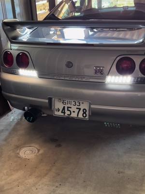 A post by @aym_bcnr33 on TikTok caption: ガレージに眠る#nissan #skyline #gtr #r33gtr #スポーツカー女子 