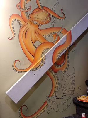 A post by @rikoquiero on TikTok caption: décoration tattoo shop kraken peinture art #artmural #peinture #decoration