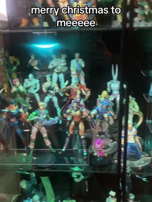 A post by @illumiminaj on TikTok caption: twit saw it first BUT I finally got a glass case for my plastic gifts from above, shoutout my husband for always getting me the best xmas gifts ♥️🕺🏻 love that guy #animefigure #jjba #anime 