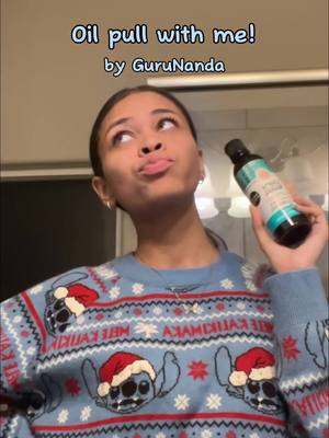 A post by @.greeneyedgf on TikTok caption: Nighttime oral care routine step by step + how to oil pull! #gurunanda #gurunandaproducts  #pullingoil #oralcareroutine #oralcare