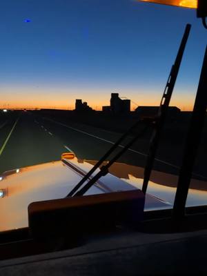 A post by @santa_bananas on TikTok caption: #sunrise #texas #nofilter #longhood #beautifulview #beautiful #relax #goodsong #lukecombs #kenworth #babyblue #kw900l #wax #goodmorning 