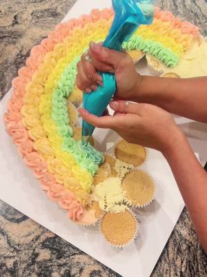 A post by @mirnacakes on TikTok caption: Making of rainbow cupcakes #