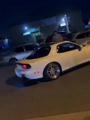 A post by @ill_vibe on TikTok caption: Mazda Rx7 🤤 The actions in this video are performed by professionals. DO NOT ATTEMPT. #car #cars #carmeet #carsoftiktok #jdm #jdmcars #mazda #rx7 #mazdarx7 #drift #drifter #supra #gtr #toyota #nissan 