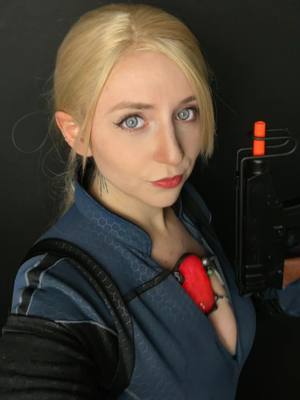 A post by @ashenqueendesigns on TikTok caption: Look something else I found on my phone 💙 I really wanted this cosplay to be epic been on my list for 10yrs... Maybe this year I'll re-wear and see how I feel 💙💙 ⚠️prop⚠️ #residentevil5 #residentevil #jillvalentinecosplay #jillvalentine #residentevilcosplay #handmade