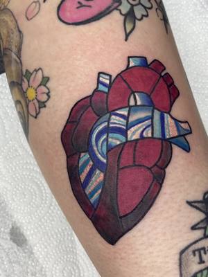 A post by @rottenranditattoo on TikTok caption: did a little thang , i really wanna do more stained glads pieces  #stainedglasstattoo #hearttattoo #femaletattooartist #femaleownedshop #allfemaleshop #colortattoo #abstract tattoo