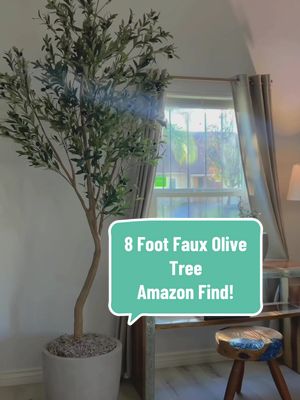 A post by @theitmom on TikTok caption: Bought an 8 foot (96 inch) faux olive tree, pot and spanish moss on @Amazon for almost HALF the cost of the one at @Costco Wholesale! And it looks AMAZING! Comment “olive tree” if you want the links to my purchase.  #amazonfinds #amazonhome #homedecorideas #costcofinds #costcotiktok #amazontiktok #interiordesign #interiordesigner #interiordecorating #interiordecor #สปีดสโลว์ #สโลว์สมูท 