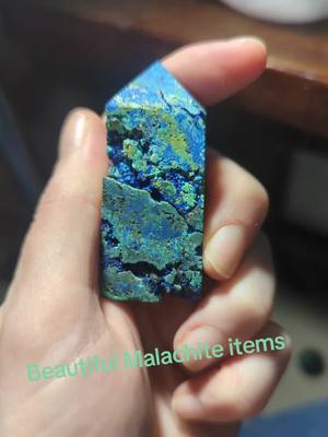 A post by @hq.aka.hollie on TikTok caption: Malachite #crystals #nature #raw #polished 