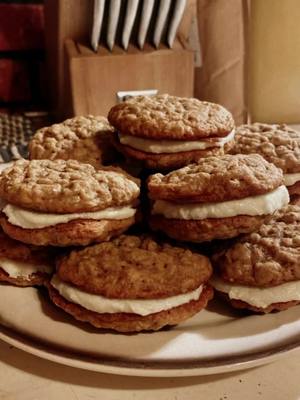 A post by @clickclickbambi on TikTok caption: Oatmeal cream pies! Heres the recipe i used!                                                          1 cup unsalted butter softened 1 cup brown sugar packed ½ cup granulated sugar 1 tablespoon molasses 2 teaspoons vanilla extract 2 large eggs 2 cups all-purpose flour  ½ teaspoon cinnamon 1 teaspoon baking soda ¼ teaspoon salt 3 cups quick oats.                                           And for the frosting                                ¾ cup unsalted butter softened 2 ounces cream cheese      3-4 cups powdered sugar 1 teaspoon vanilla extract ¼ teaspoon salt