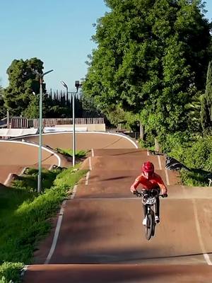 A post by @niekkimmann on TikTok caption: Chasing the drone 🚁 in Bellflower! #bmx #bmxracing 