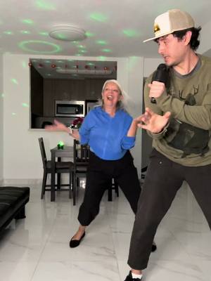 A post by @georgeakram on TikTok caption: Mom: “George: we need to create content. Wanna do this one?” #heridea #momandson #dance #letsgo #backatitagain #laculebritica C: @Miguel Alessandro 