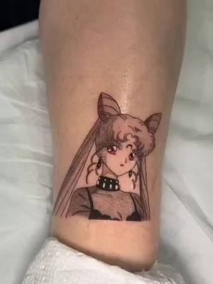 A post by @massielnh on TikTok caption: today is #naokotakeuchi birthday! Here's my new #darklady tattoo by #carocaro @Cake Is a Lie Tattoo Parlor #sailormoon  #usagitsukino #chibiusa 