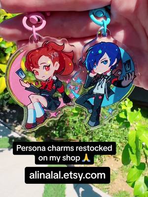 A post by @alinalal_ on TikTok caption: The persona 3 ones got CLEANED OUT last time lol  . . #persona3 #persona #merch #fanart #charms #acryliccharms #keychains #etsy #animestyleart #persona5 #persona4 #animemerch #gaming