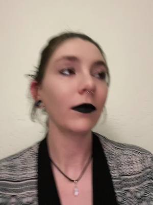 A post by @aliensmeatsuit on TikTok caption: What lipstick do I need to stop butthole lips? 🖤 #fyp #foryou #foryoupage #babybat #goth #newmusic #artemas 