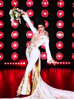 A post by @thescarletenvy on TikTok caption: Viva Las Vegas! 🔥💍♣️♥️ @RuPaul’s Drag Race @BBC Three @World of Wonder #DragRaceUK #Elvis #Vegas #DragRaceUKvsTheWorld  