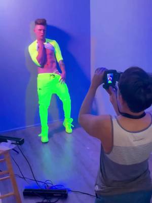 A post by @festivalfashion on TikTok caption: Follow for more! | Go behind the scenes with @joeywsuarez as he brings sunshine to the set in fluorescent yellow pants, captured by the talented photographer Nolan. Explore Joey's vibrant style and discover more electrifying looks through the #LinkinBio. 🌟📸💛 #MaleModel #joeywsuarez #joeysuarezmodels #modeljoeysuarez