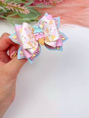 A post by @miss.o.crafts on TikTok caption: 🍦🎀✨ Scoop up some sweetness with our newest tutorial – Ice Cream Hair Bow! 🍨💖 Craft your own deliciously adorable bow using Plastic Template # 120, available in our TikTok shop! 🛍️✂️ Let's add some flavor to your hair accessory game – get the template and let the fun begin! 🌟🌈 #IceCreamHairBow #TikTokCrafts #DIYHairAccessories #fauxleatherbows #HairBowTutorial #DIYHairBows #FauxLeatherGoodness 