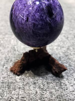 A post by @cm.us2 on TikTok caption: Really high quality charoite sphere,who know about crystal would know how amazing it is!!#crystal #crystals #crystalstone #crystalshop #crystaltok #crystalpalace #gorgeous #birthdaygift #charoite #charoitecrystal 