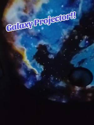 A post by @classwithchellz on TikTok caption: I am literally obsessed with this projector! 12 different discs.. the colors are so vibrant! Beautiful!!  #projector #space #galaxy #treatyourself #fyp 