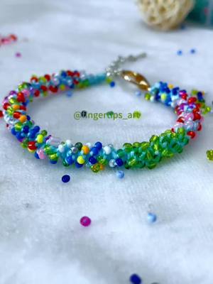 A post by @fingertips_art on TikTok caption: How to make a bracelet#bracelet #beadjewlery #beads #tutorial #accessories #handwork #DIY #handwork #diybracelet #easydiy 