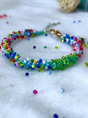 A post by @fingertips_art on TikTok caption: The end of the last bracelet#DIY #diybracelet #easydiy #tutorial #handwork #accessories #beads #beadjewlery #bracelet #girl 