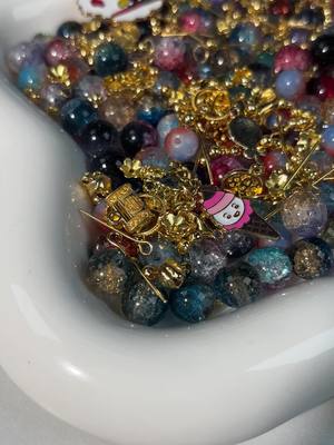 A post by @charmsmart_012 on TikTok caption: Check out the pretty charms and beads 😍😍 #DIY #charms #beads 