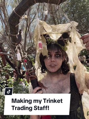 A post by @hailierosie on TikTok caption: How I made my staff for trinket trading!! I cant wait to use this method to make more staffs in the future. I loved how my Bog Witch staff turned out, and I plan on making a more wizard-y staff soon! Happy crafting! #renfaire #fantasy #craft 