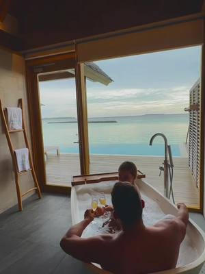 A post by @luxuryworldtravellers on TikTok caption: Do you believe that home is not a place but a person? #couplesgoals #maldives #traveling 