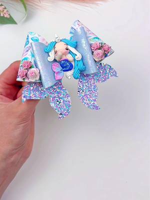 A post by @miss.o.crafts on TikTok caption: 🧜‍♀️ Dive into DIY magic with our Mermaid Hair Bow Tutorial! 🎀✨ Using Plastic Template # 136, you can create enchanting hair accessories that shimmer and shine like the sea. Follow along for step-by-step instructions and let your inner mermaid shine! 🌊💙 #DIY #MermaidHairBow #CraftTutorial #CreativeFun #hairbowtutorial #hairbowtemplate #diyhairbow #howtomakehairbows #mermaid #mermaidhair #mermaidhairbow 