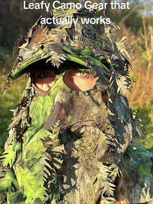 A post by @quikcamo.com on TikTok caption: Leafy Camo Ghillie Suits, Face Mask Hats, and Gloves #camo #camouflage #bowhunting #hunting #quikcamo 