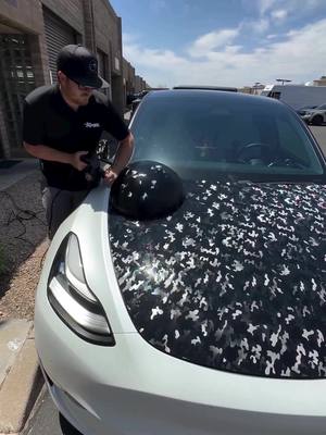 A post by @signmakertools on TikTok caption: #tesla Beluga or Pokemon? There are different ways to remove the vinyl. #wrapshop #ppf #xpel #ppftools 