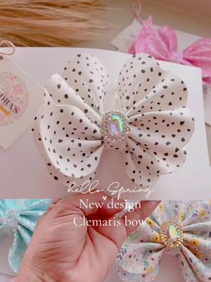 A post by @kendrasbows on TikTok caption: New design created by kendra’s bows🌸Clemantis bow available only live sale#bows #newdesign #bowsforsale #coquettegirl #moños #new #coquettefashion #tik 