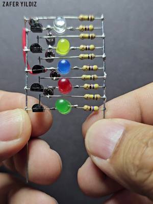 A post by @zaferyildiz_ on TikTok caption: LEDs Charser Using Transistors Without PCB , DIY Electronic Project #zaferyildiz_ #ledlights #tesla #experiment #brushless #shorts #led #leds 