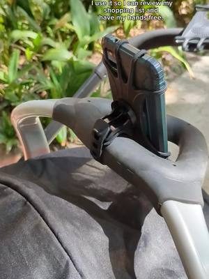 A post by @jennyxspace on TikTok caption: this phone holder definitely makes motherhood better #strollerhack #stroller #tiktokfinds #universalphoneholder #foryoupage 