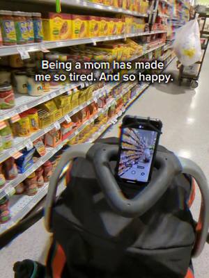 A post by @jennyxspace on TikTok caption: Being a mom has made me so tired. And so happy.#strollerhack #stroller #tiktokfinds #universalphoneholder #foryoupage 