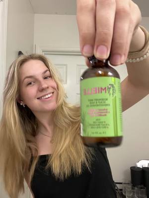 A post by @cccaroline.com on TikTok caption: This is my holy grail! I use this oil before almost every hair wash and it has helped my hair grow faster and become thicker over the past year! One of the best purchases I have ever made #hair #hairoil #oiling #TikTokShop #haircare #haircareroutine 