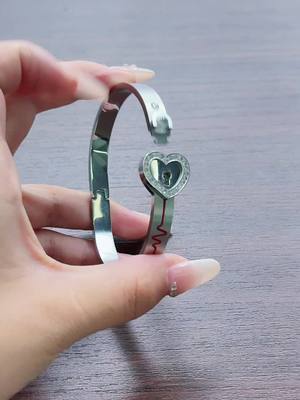 A post by @yoiv181 on TikTok caption: I love you engraved in 100 different languages#bracelet 