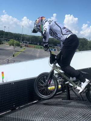 A post by @kamrenlarsen on TikTok caption: How many pedals to the bottom of the hill ? #bmx #fyp #gatestart #bmxracing 